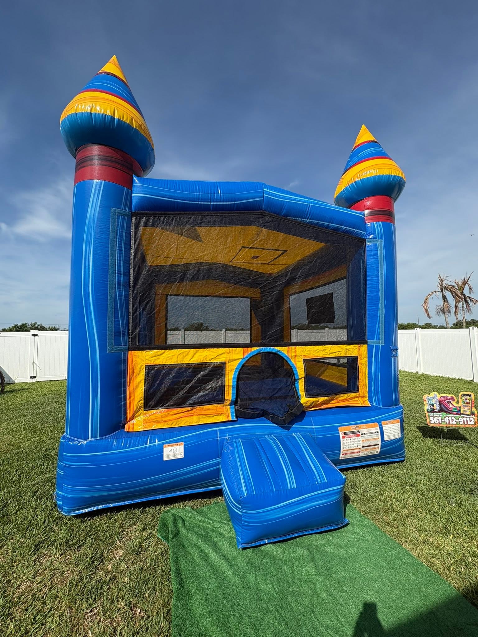 Describe this bounce house — style, colors, theme